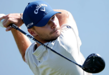 Cadillac Championship 2026: Betting Odds, favorites to win Male golfer in a light gray polo swinging a driver, wearing a blue Callaway cap against a clear blue sky.