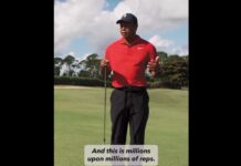 The GOAT shows off for Freddy in this Masterclass wedge practice session Man in a red polo shirt and black cap stands on a golf course, holding a golf club; a caption at the bottom reads, 'And this is millions upon millions of reps.'