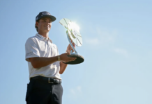Winners, Losers & Payouts: Jackson Koivun Announces Himself, Scottie Charges, and the FedExCup Bubble Gets Brutal Golfer lifting a shiny circular trophy on a sunny day against a clear blue sky.