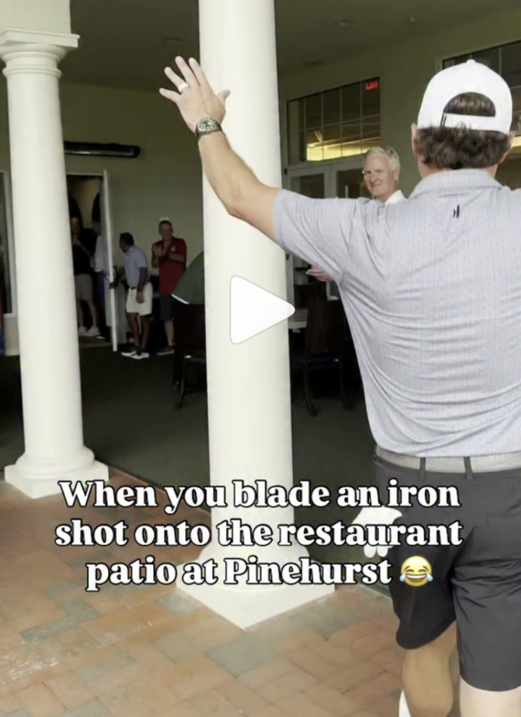 Humorous scene: man with outstretched arm on a patio outside a restaurant, bystanders watching; caption about blade iron shot at Pinehurst.